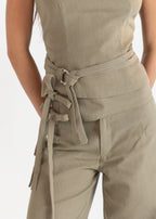 Beige jumpsuit with a belt on a white background