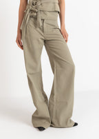 Khaki wide-leg pants worn by a person on a white background